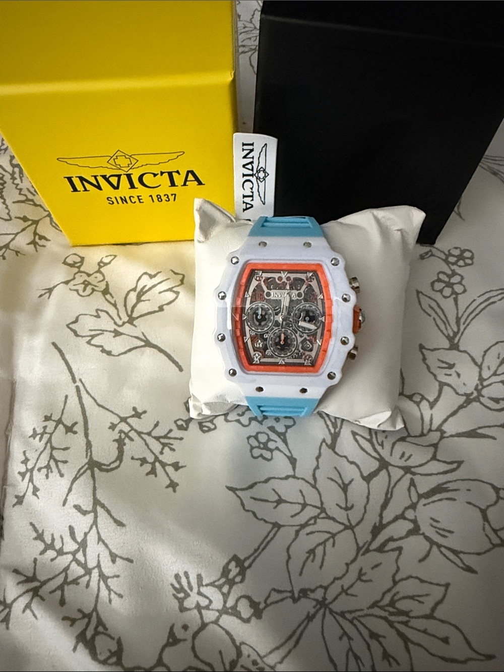 Invicta White Case Blue Strap Chronograph with Orange Dial Accents
